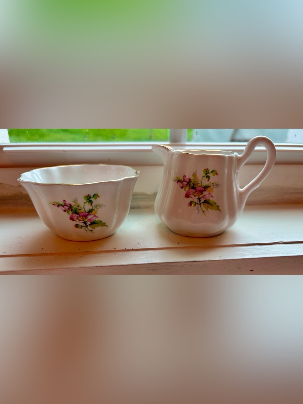 White Porcelain Bone China Creamer and Sugar Set with Pink Floral Accents.